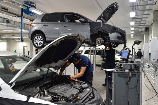 Professional auto repair workshop with diagnostic equipment